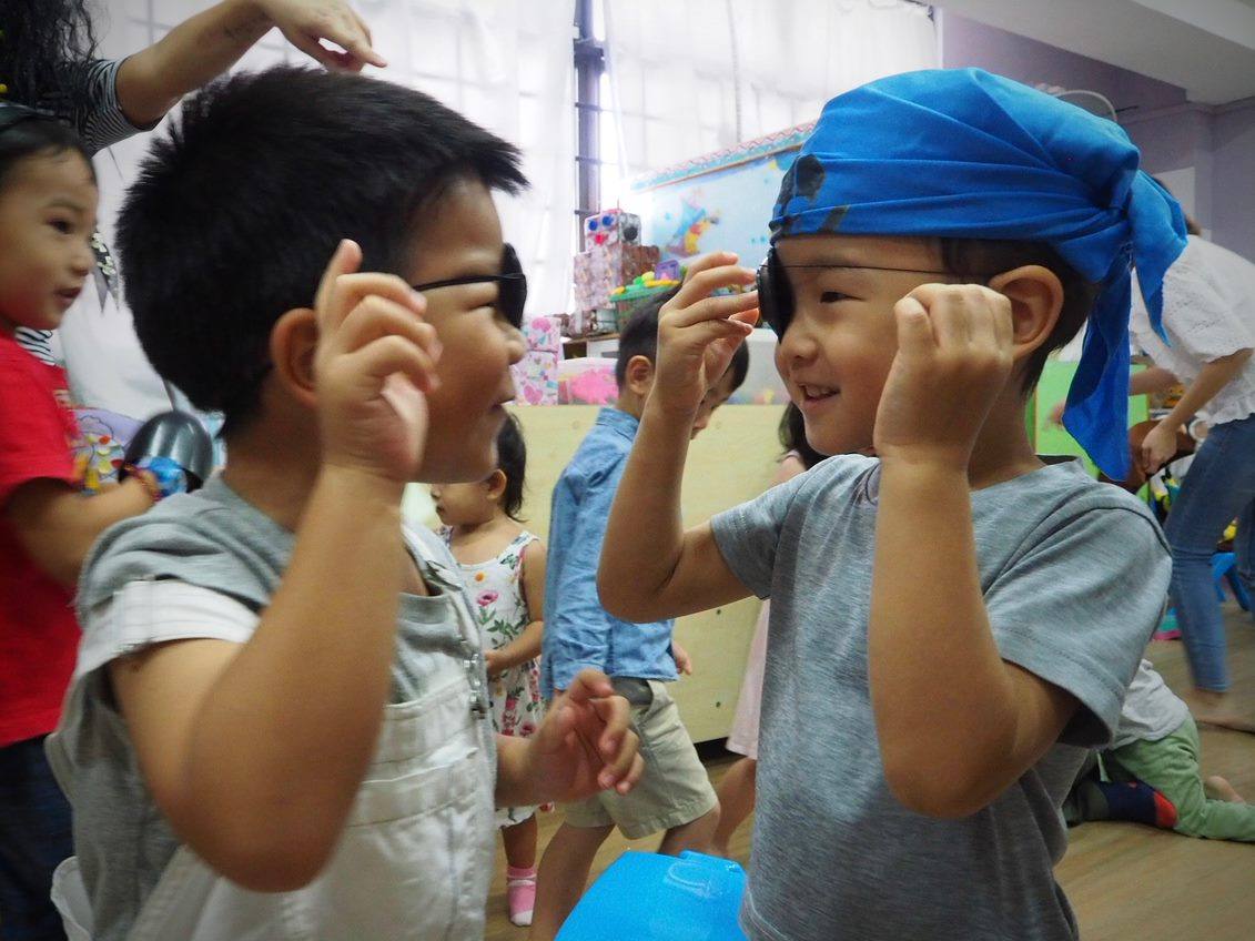 Children at BTPC Children&rsquo;s Ministry with their hands raised